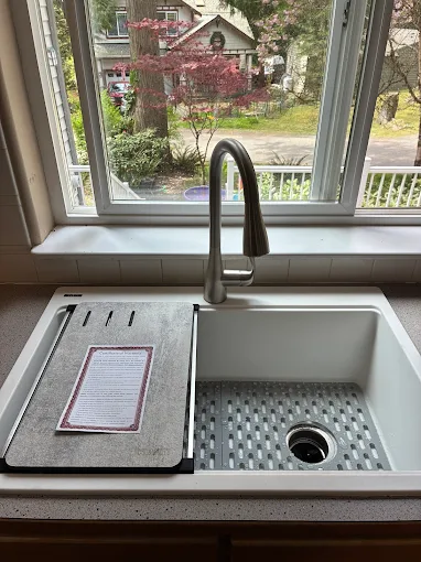 New kitchen sink with stainless arched faucet